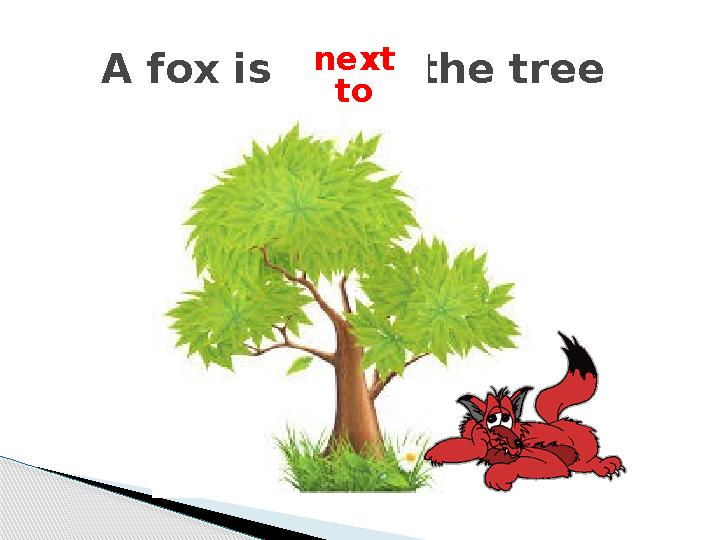 A fox is . the tree next to
