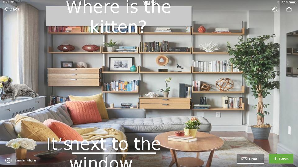 Where is the kitten? It’s__________ next to the window.